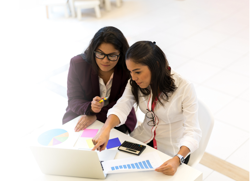 Two women discussing report